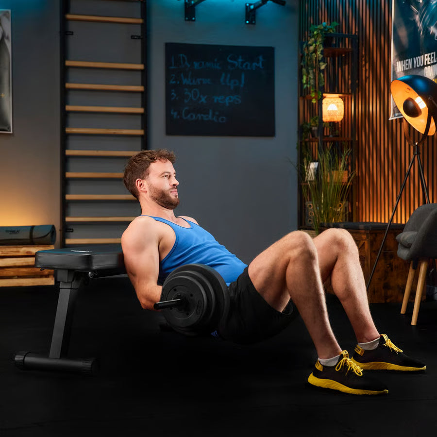 Man exercising with a barbell in a home gym setting