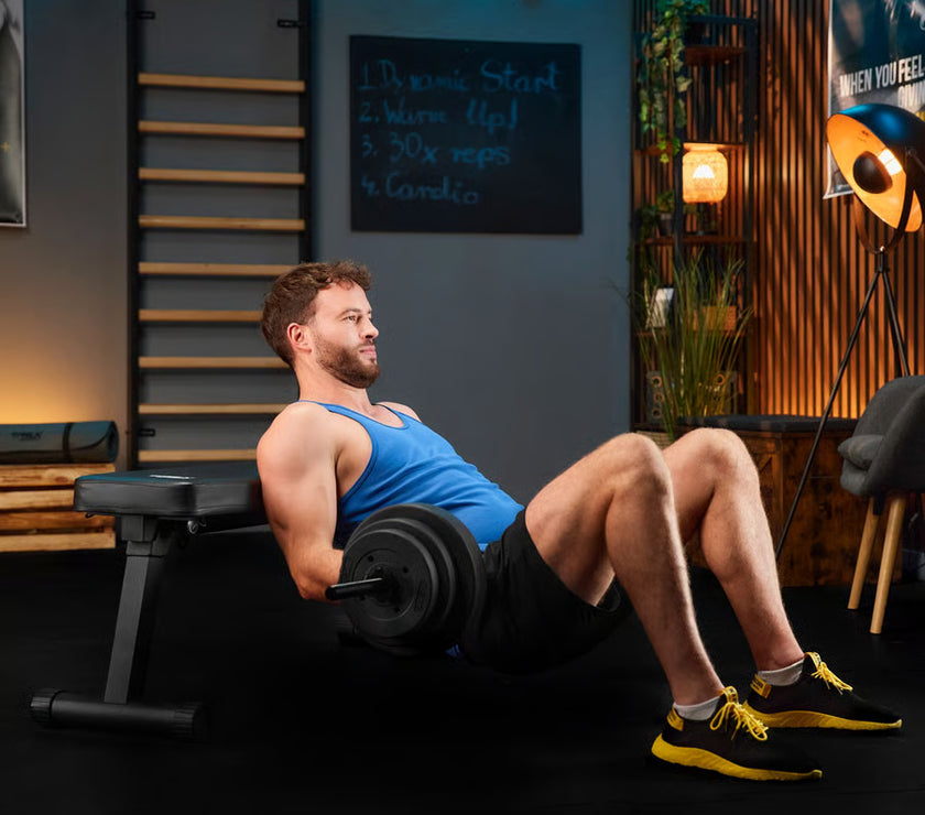 Man exercising with a barbell in a home gym setting