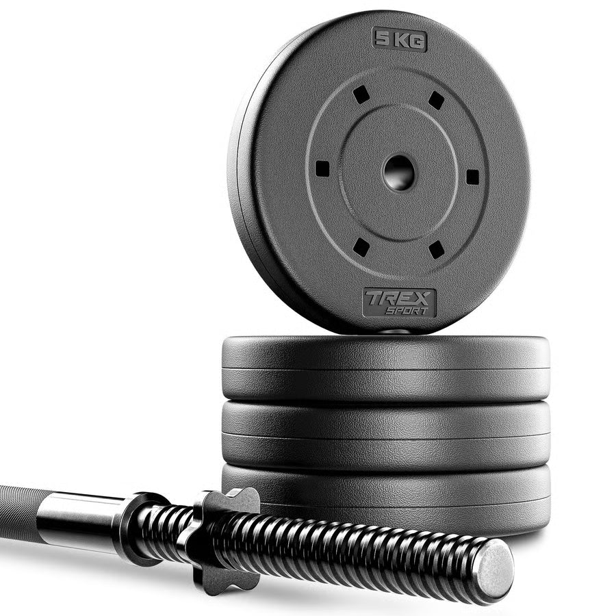 Stack of weight plates with a barbell on a white background