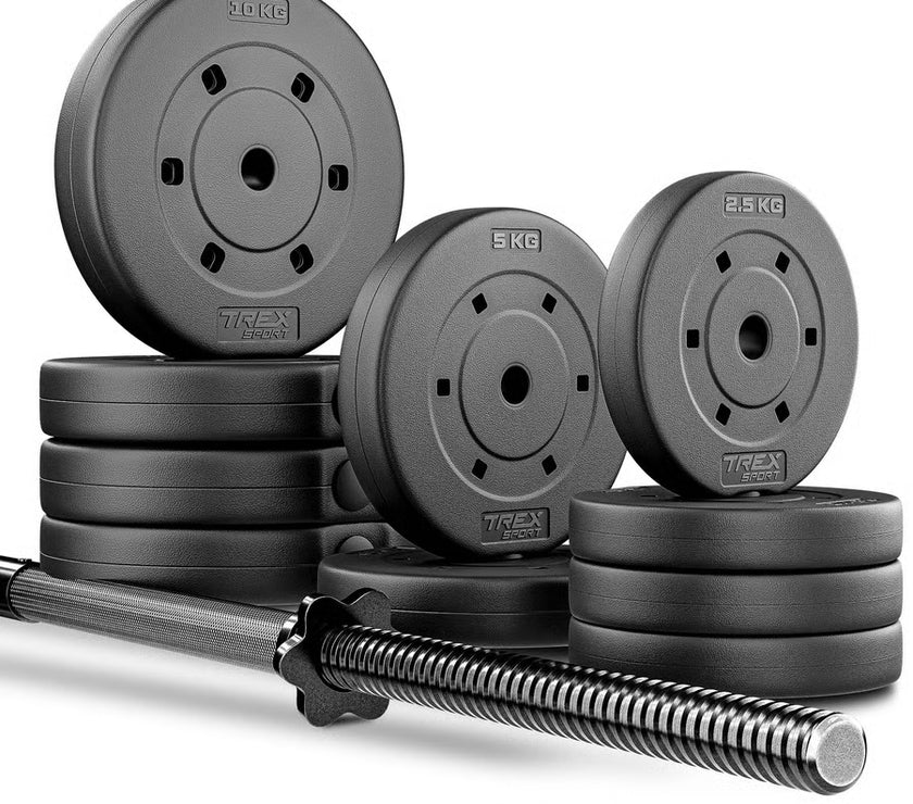 Set of weight plates and barbell on a white background