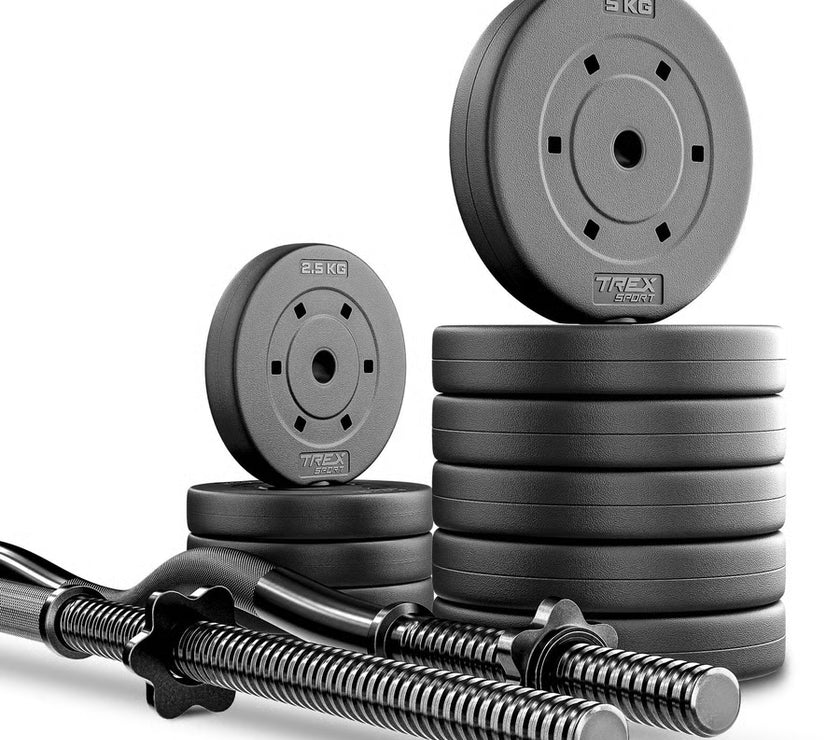 Stack of weight plates and barbell on a white background