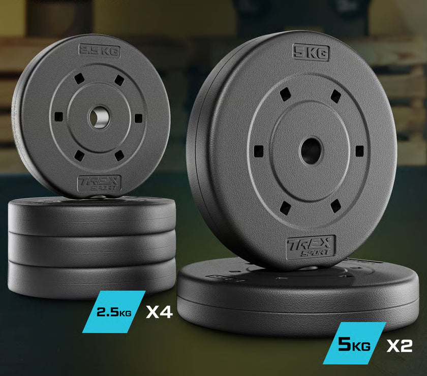 Stacks of gym weight plates with 'TREX Sport' branding on a dark background