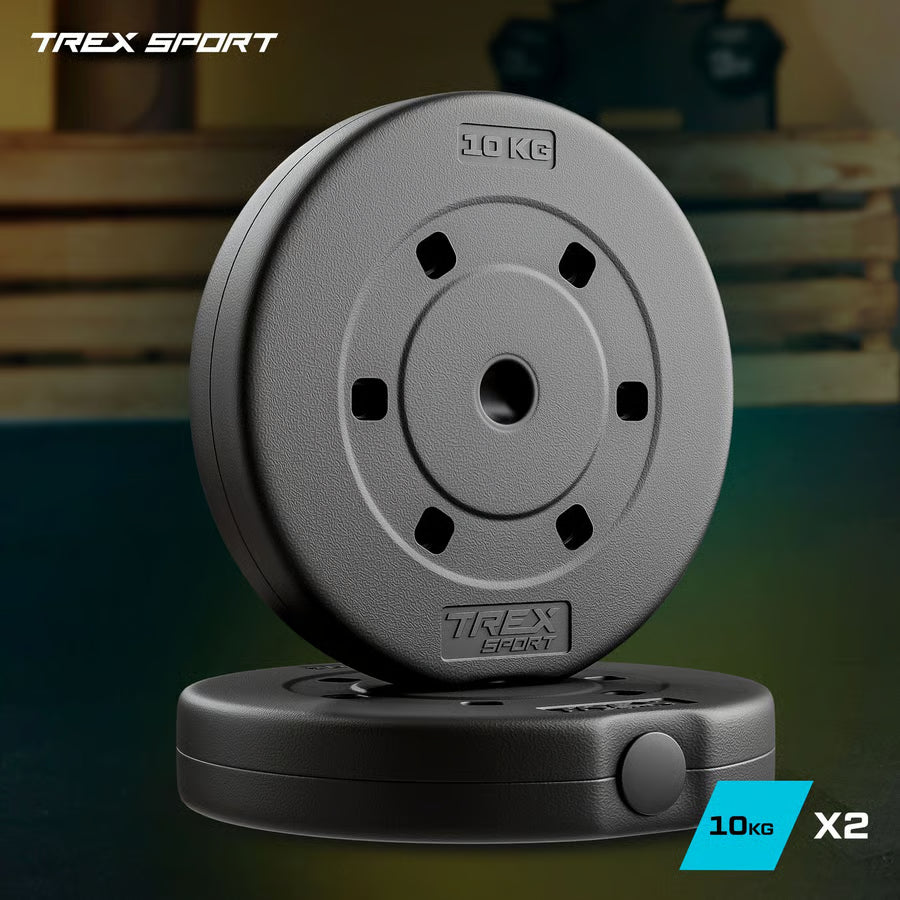 Two gray weight plates with 'TREX Sport' branding on a blurred background